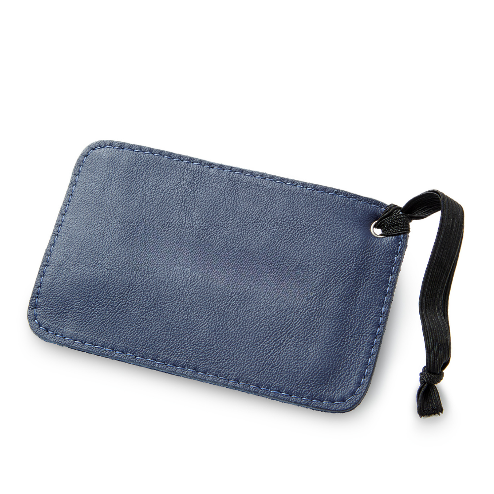 A close-up image of The miina tranquilo luggage tag crafted from sustainably sourced materials, featuring a minimalist design with a smooth finish, eco-friendly texture, and an elegant strap for easy attachment to bags.
