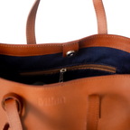 Christal leather tote in caramel colour top view on white background