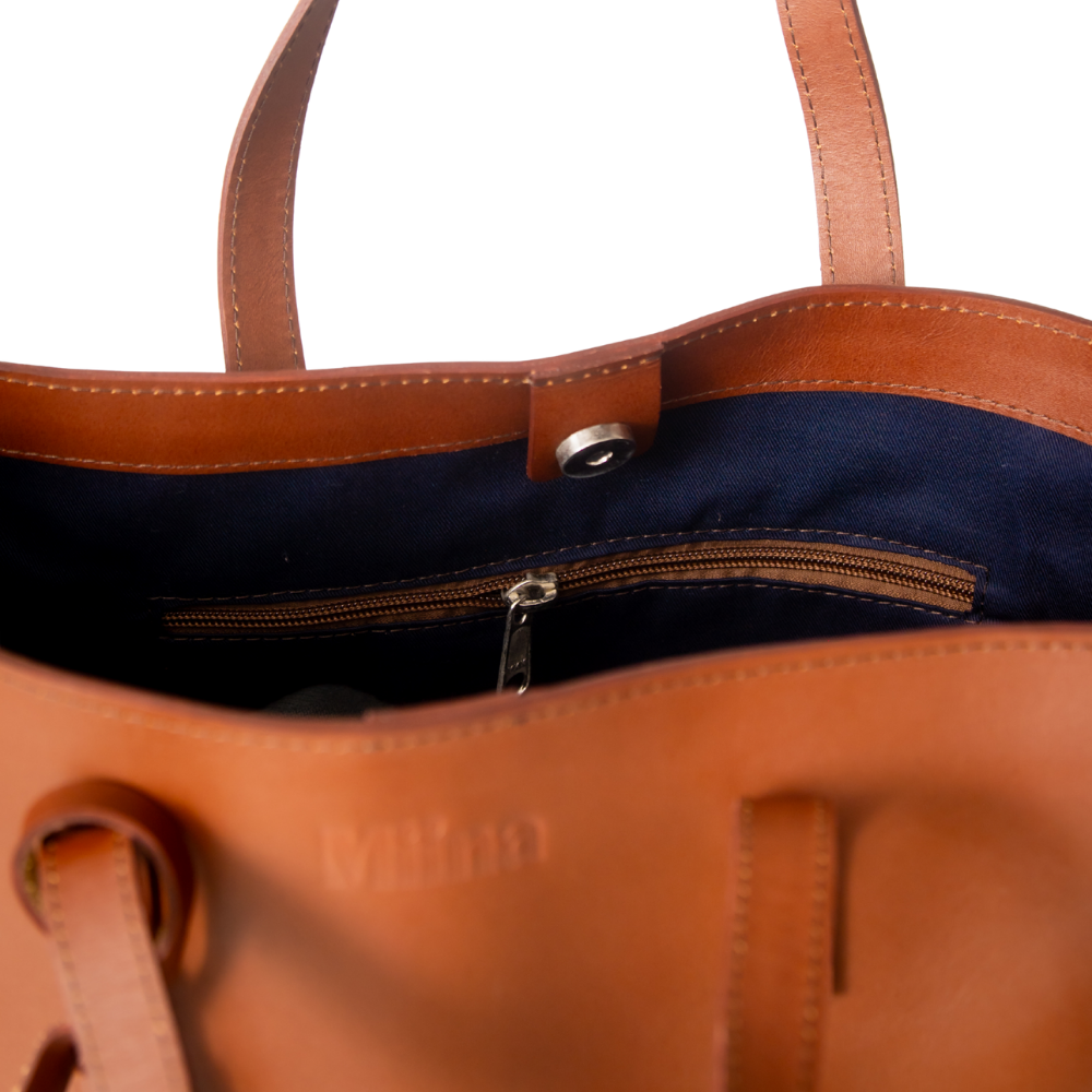 Christal leather tote in caramel colour top view on white background