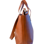 Christal leather tote side view in caramel colour on white background