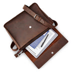 Gabriel leather messenger bag from Miina Goods  with a tablet and pen on a white background