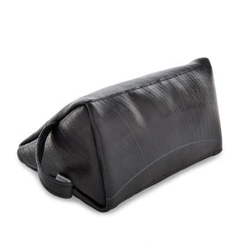 Miina Goods Montaña leather toiletry bag in black  leather showing the upcycled tire bottom 
