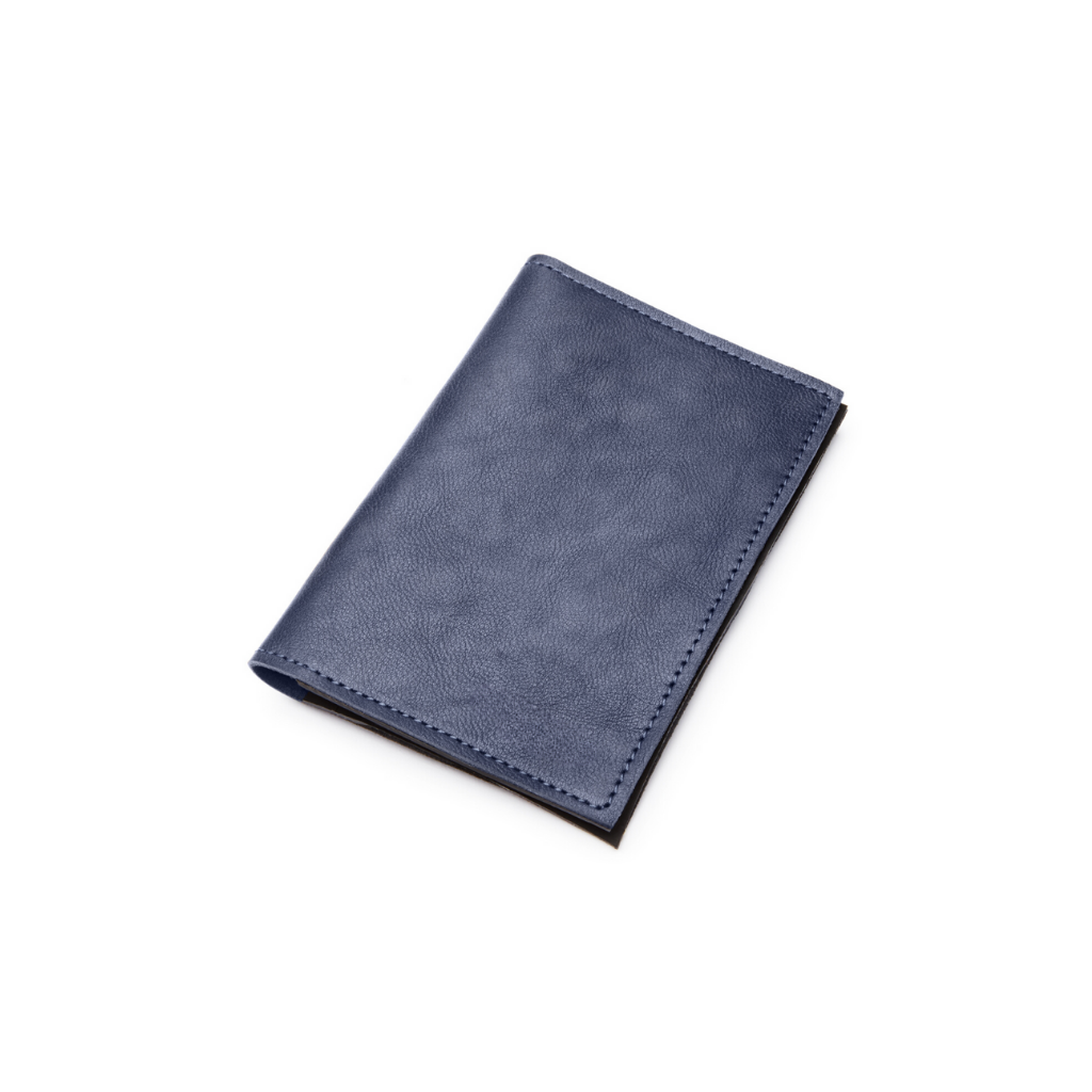 The Pearson Blue Upcycled aircraft leather passport holder on a white background by Miina Goods
