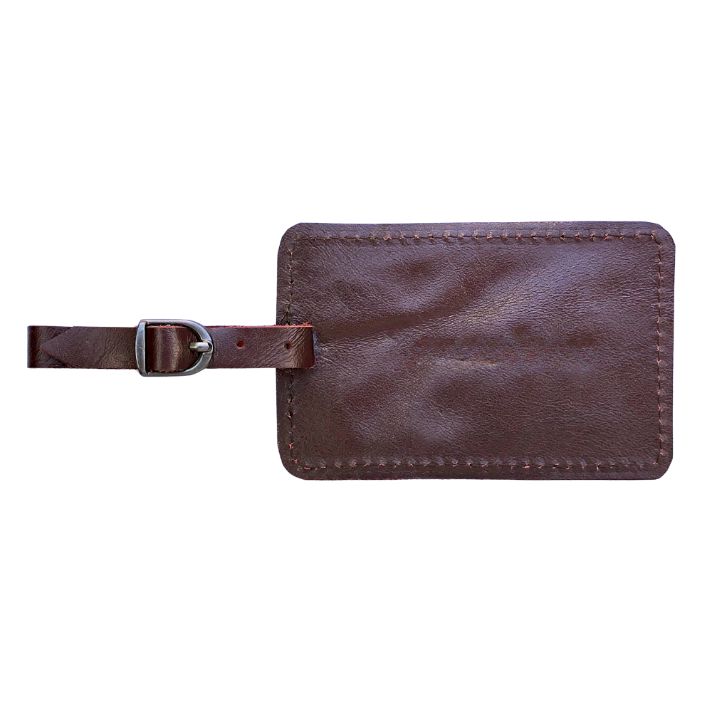Miina Goods  red leather luggage tag  on a white background made from upcycled plane seat leather