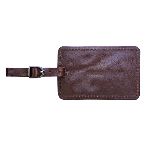 Miina Goods  red leather luggage tag  on a white background made from upcycled plane seat leather