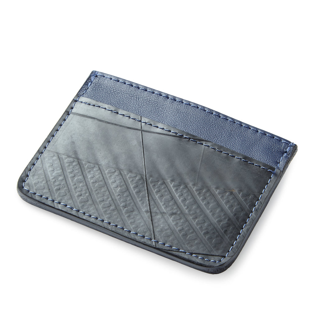 Blue leather cardholder from Miina Goods on a white background and made from upcycled plane seat leather. 
