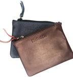 The dinero atlantic blue and red earth burgundy upcycled Airplane Leather Pouches on white 