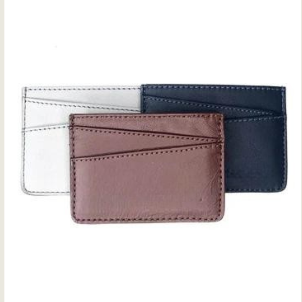 Three leather card holders in different colors on a white background from Miina Goods and crafted with upcycled plane seat leather 