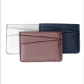 Three leather card holders in different colors on a white background from Miina Goods and crafted with upcycled plane seat leather 