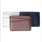 Three leather card holders in different colors on a white background from Miina Goods and crafted with upcycled plane seat leather 
